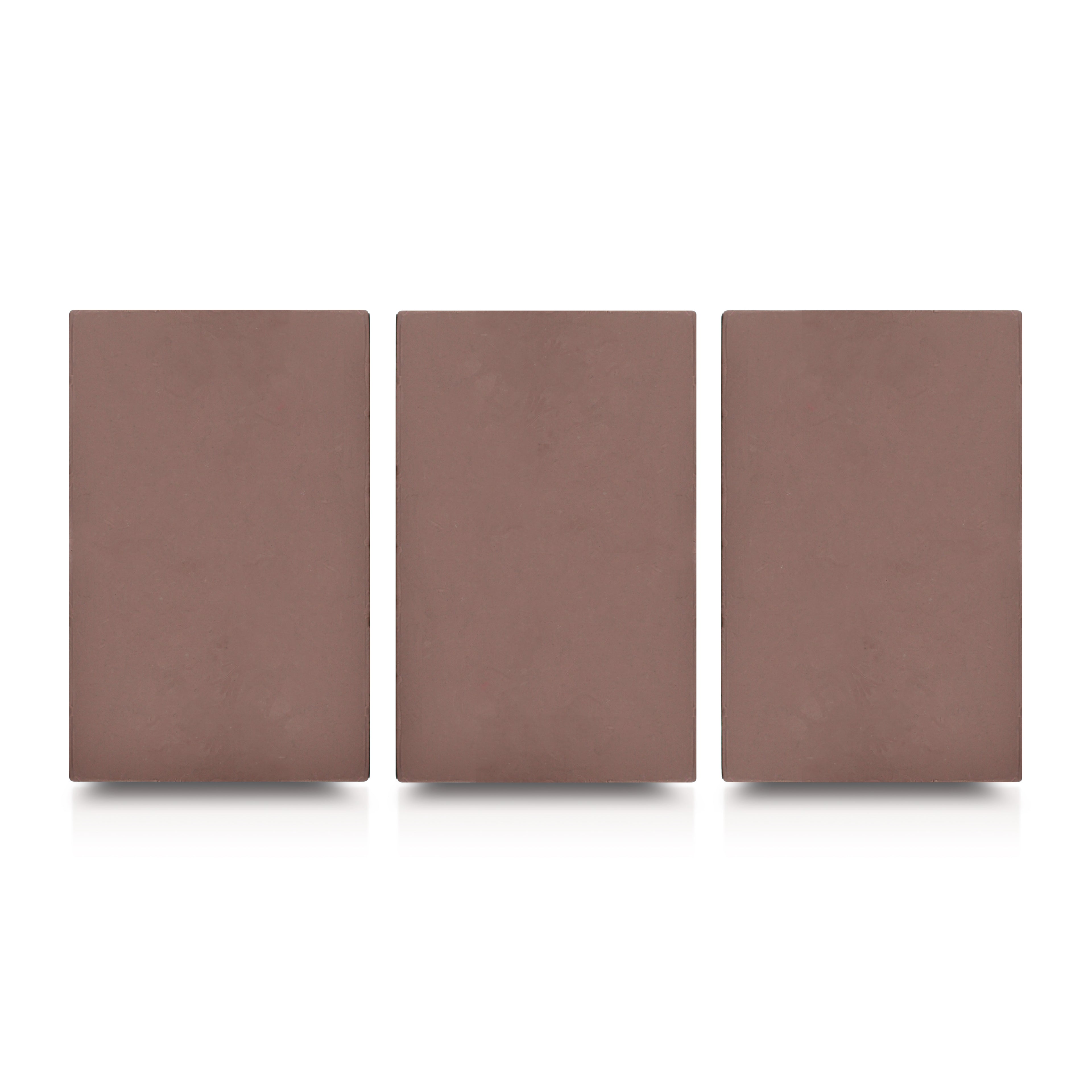 Three rectangular brown clay slabs with smooth textured surfaces displayed side by side on a light gray background.
