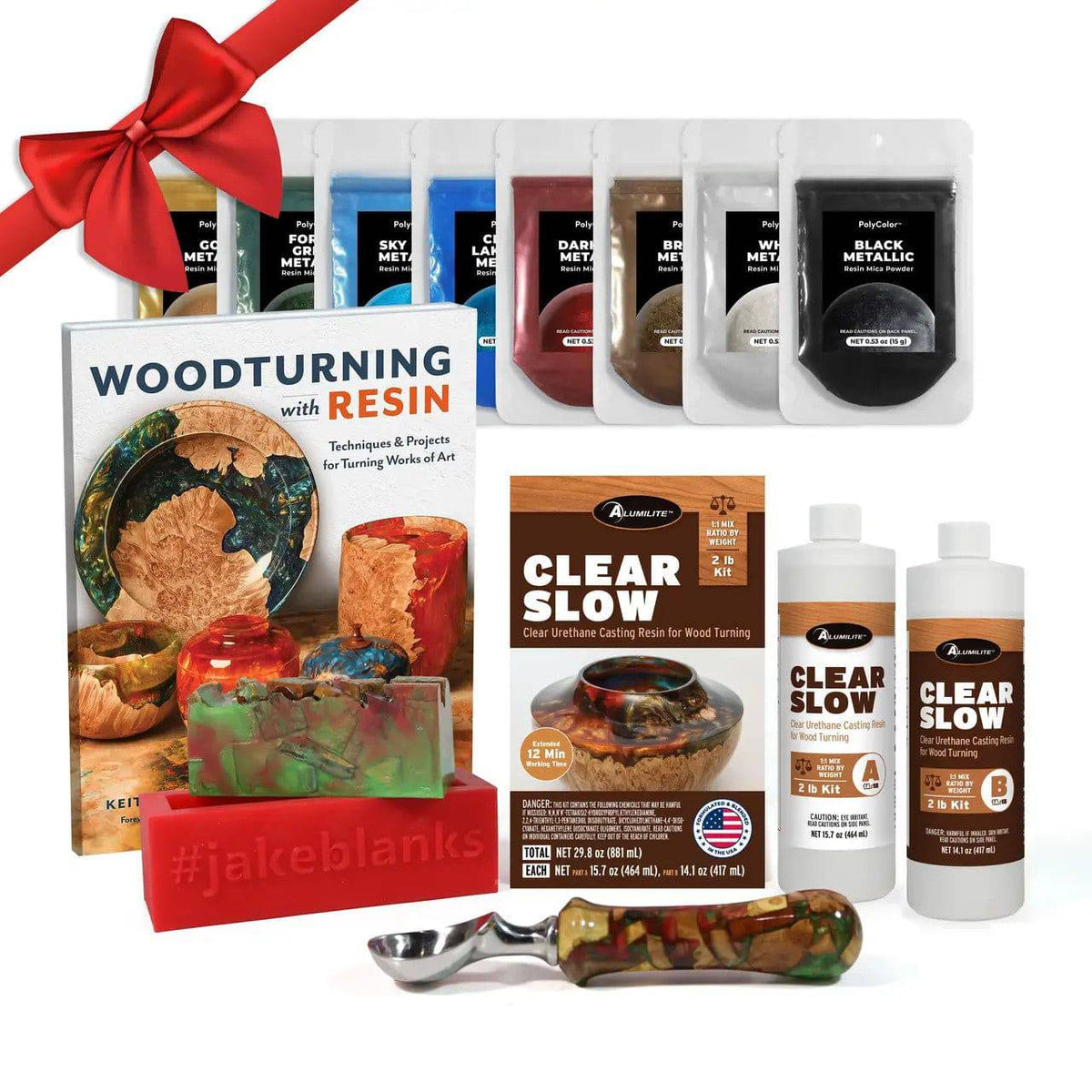 Woodturning resin starter kit with casting resin, pigments, mold, pen blank, and project book.